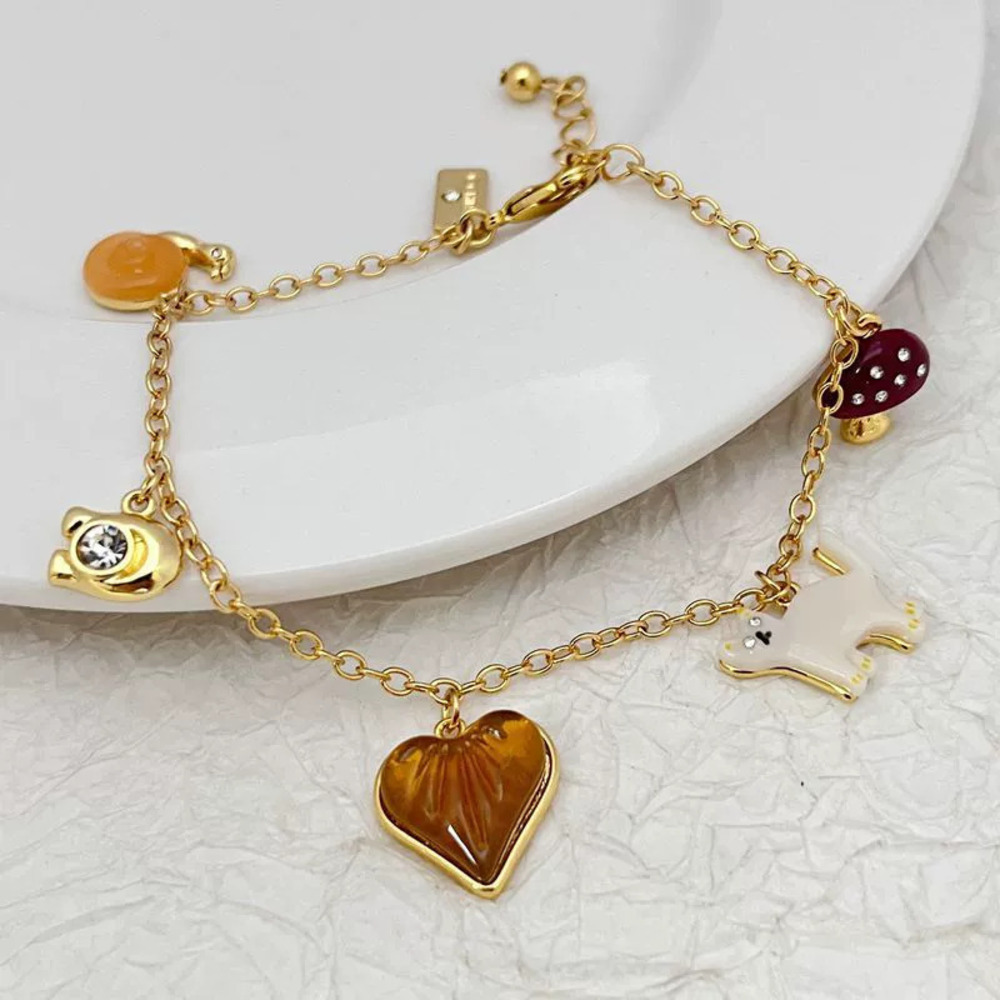 Coach Trendy Gold Plated Copper Charm Bracelet Rhinestone Snail Heart Cat